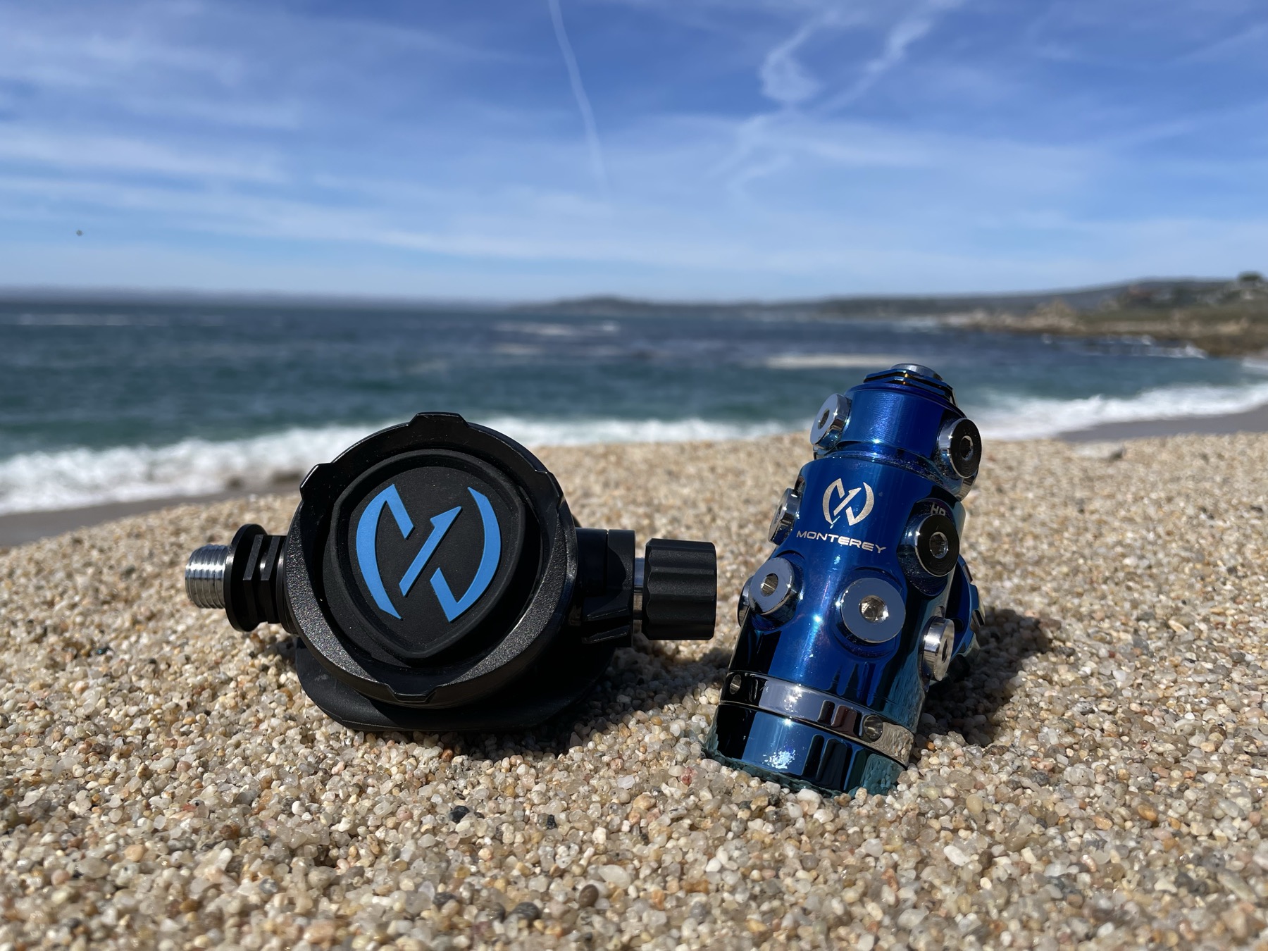 Blue Monterey first stage and a black and blue second stage on a beach