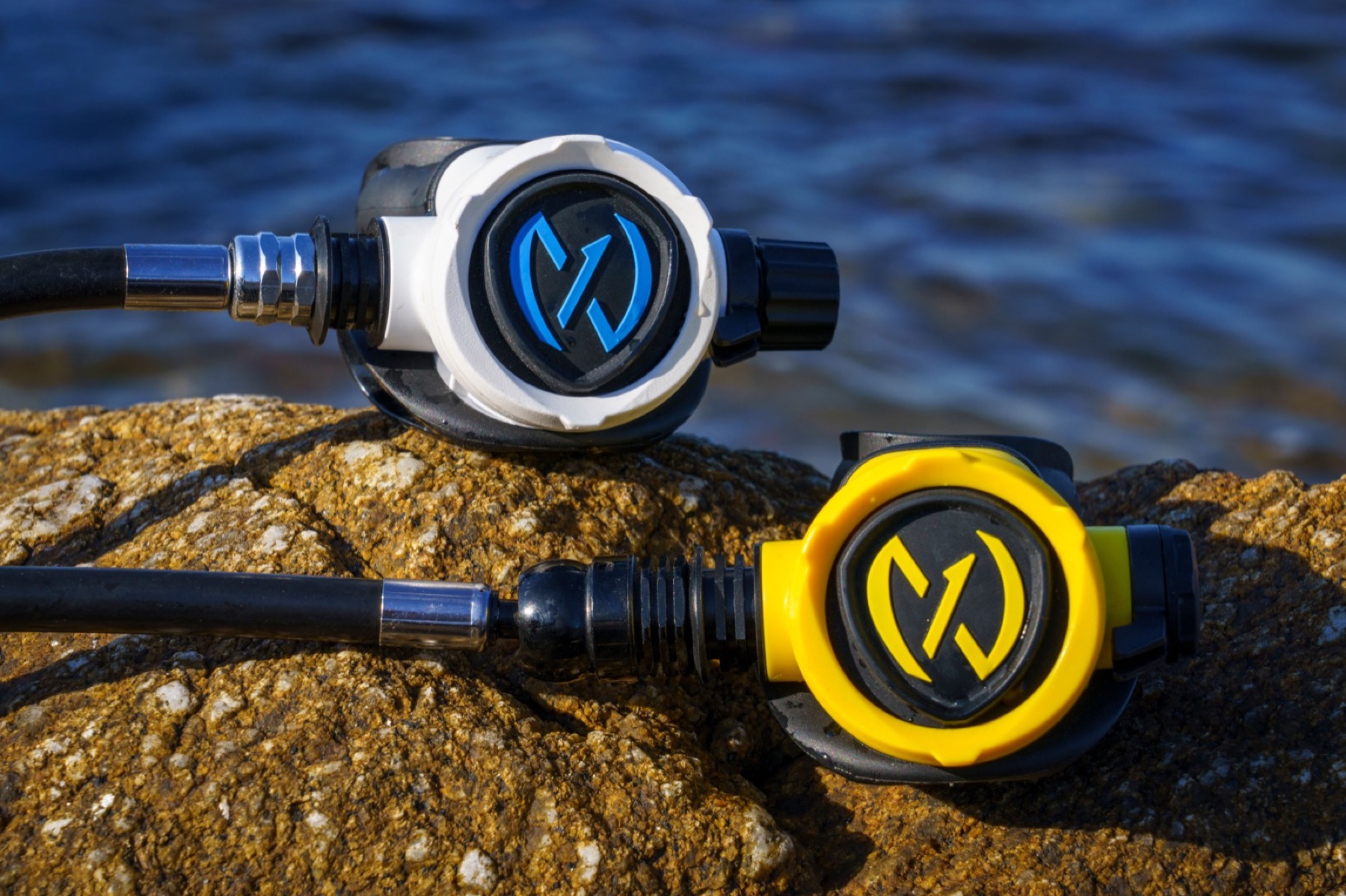 White and yellow NEX second stages photographed on coastal rocks